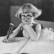 Photo of girl in glasses writing